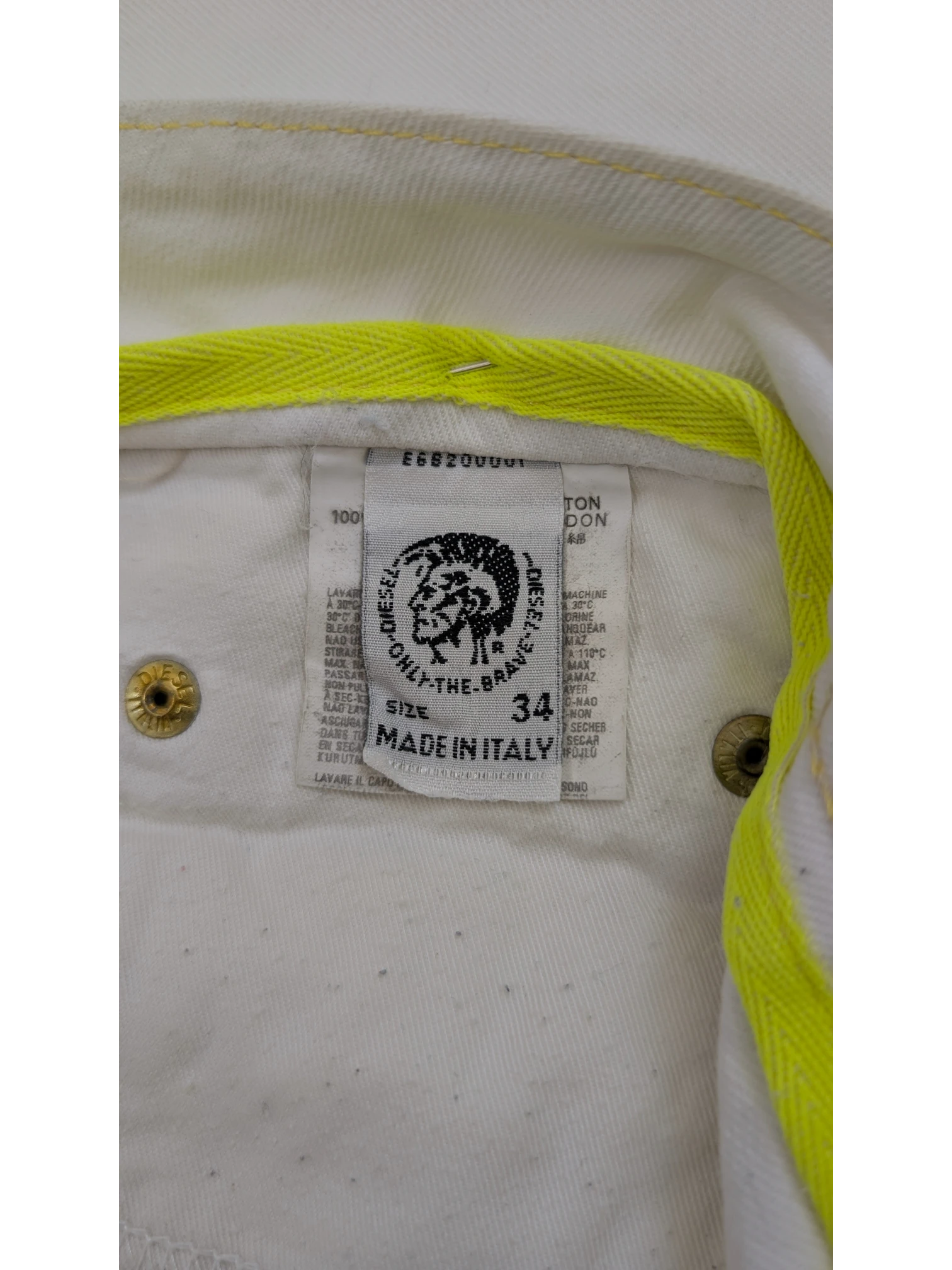 JAKE & IPI Diesel Rabox white denim jeans, size 34, made in Italy, with neon yellow trim.