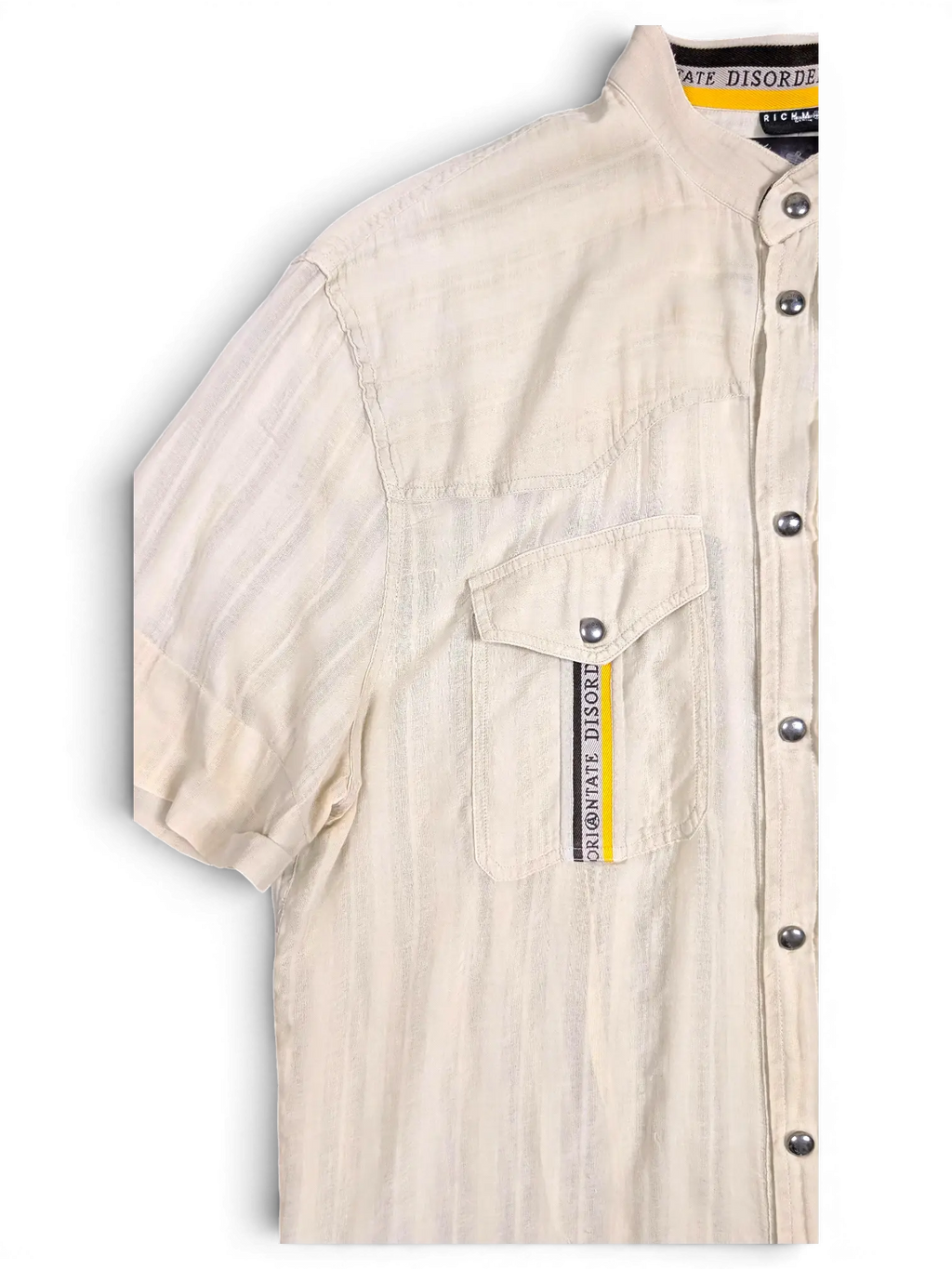 JAKE & IPI pre-owned Disorder beige utility shirt with stand collar, metal snap buttons, and chest pocket detail.