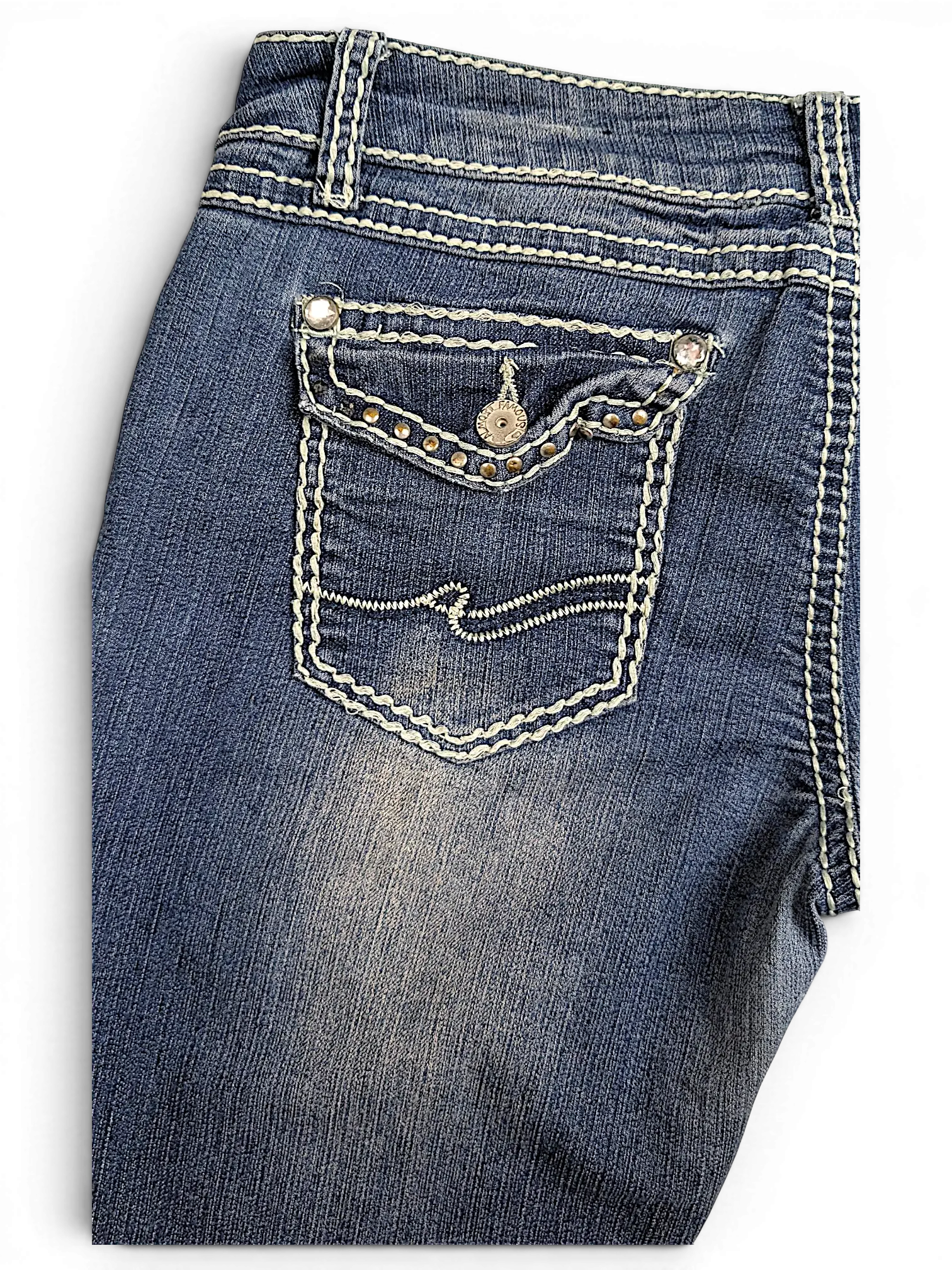 JAKE & IPI Almost Famous distressed blue denim jeans featuring white contrast stitching and embellished back pocket