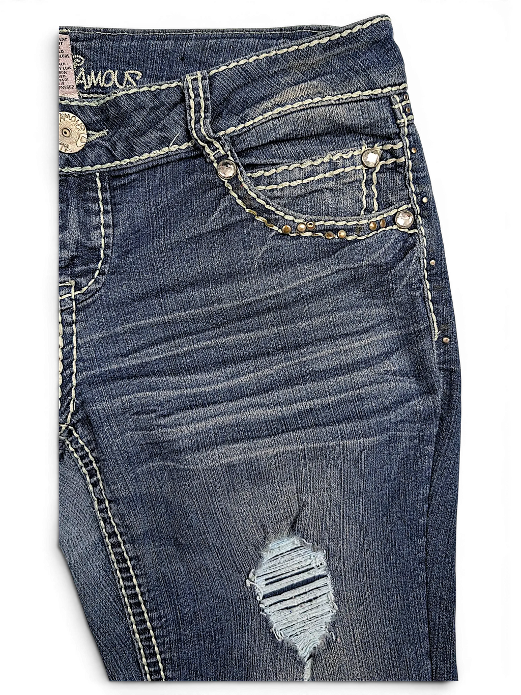JAKE & IPI Almost Famous distressed blue denim jeans with white contrast stitching and rhinestone pocket detailing.