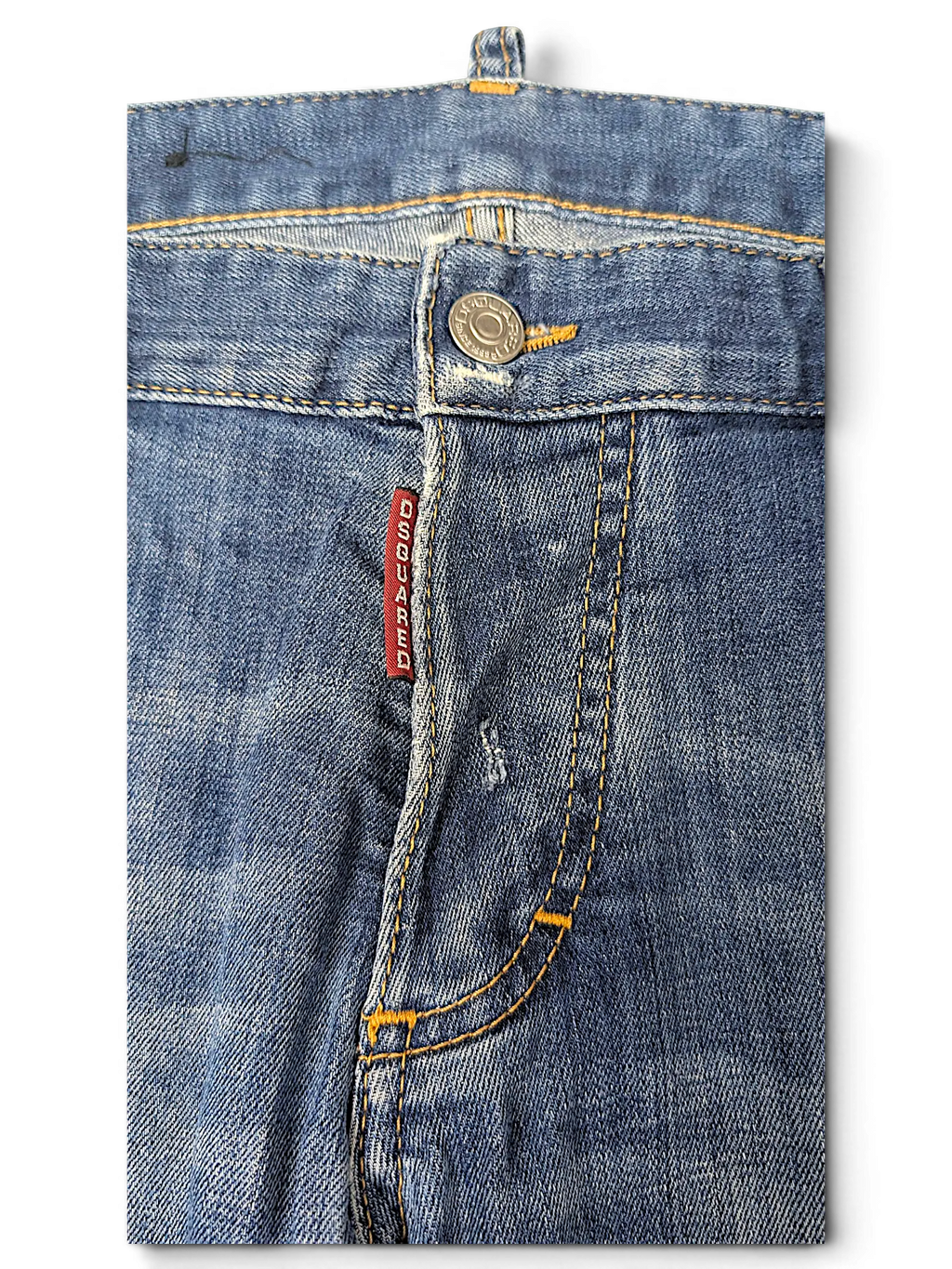 JAKE & IPI Dsquared2 blue denim jeans featuring a classic button fly with a red branded tag and contrast stitching.