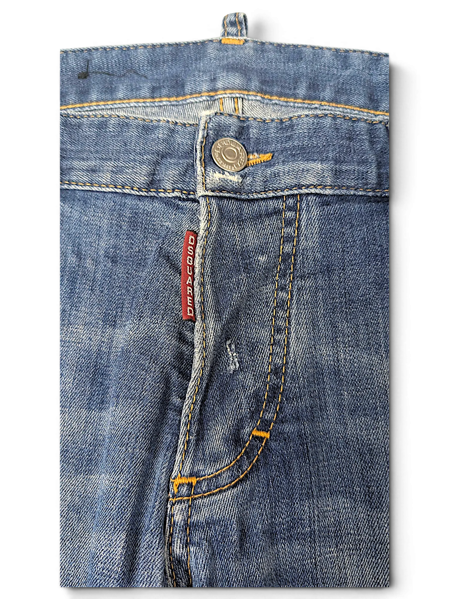 JAKE & IPI Dsquared2 blue denim jeans featuring a classic button fly with a red branded tag and contrast stitching.