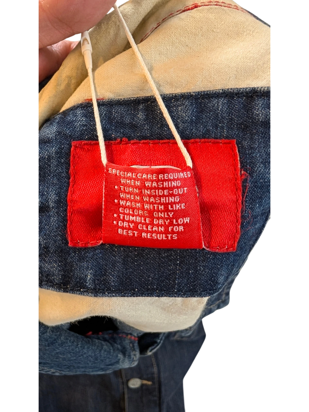 JAKE & IPI Ecko denim jacket with red care tag. Blue denim, cotton lining.