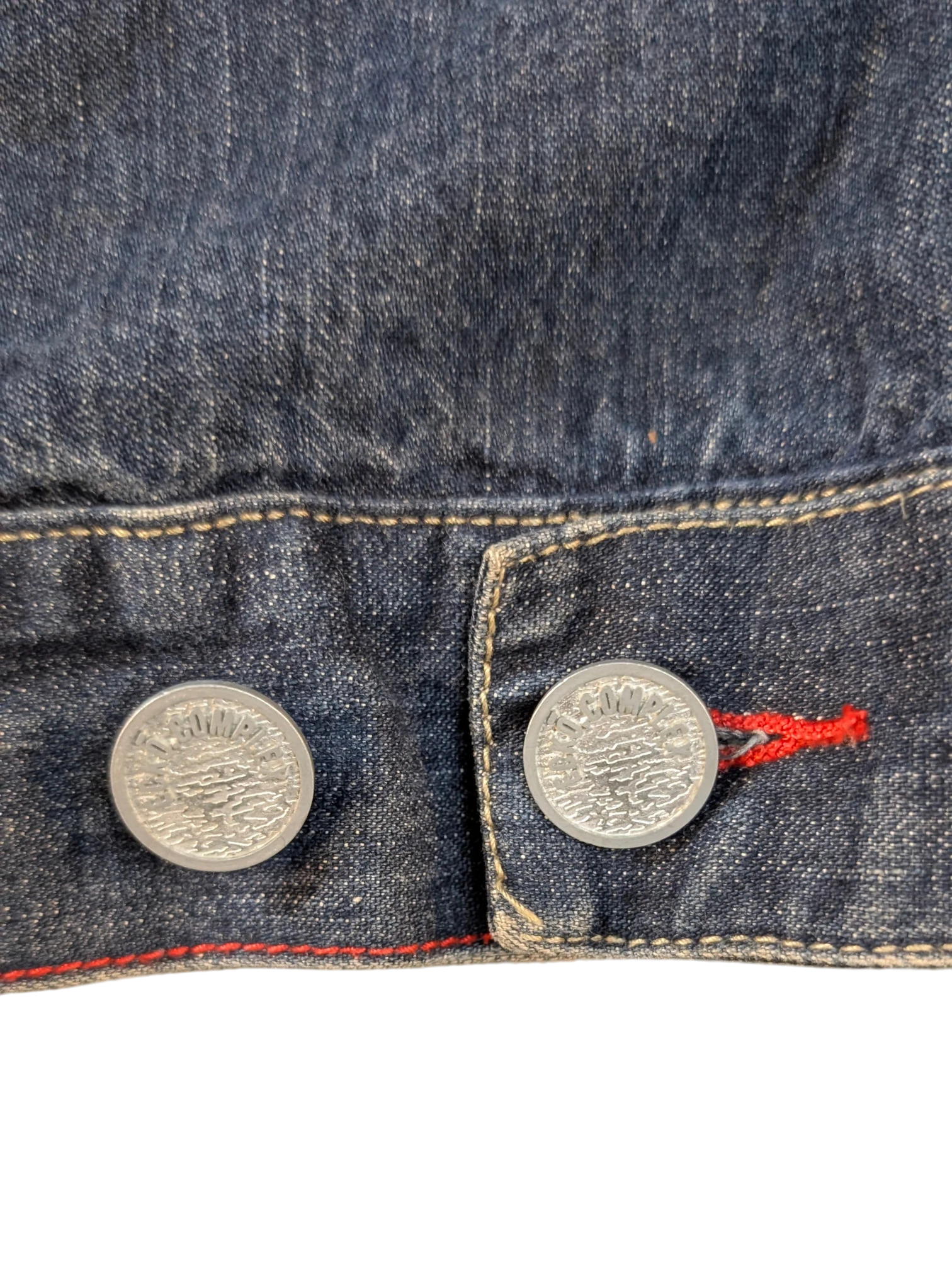 JAKE & IPI Ecko denim jacket with silver buttons and red stitching detail.