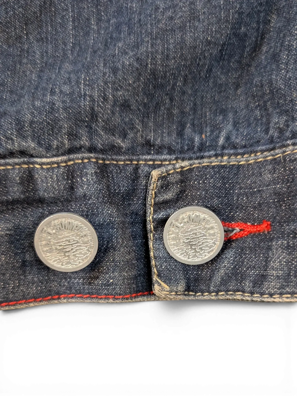 JAKE & IPI Ecko denim jacket with silver buttons and red stitching detail.
