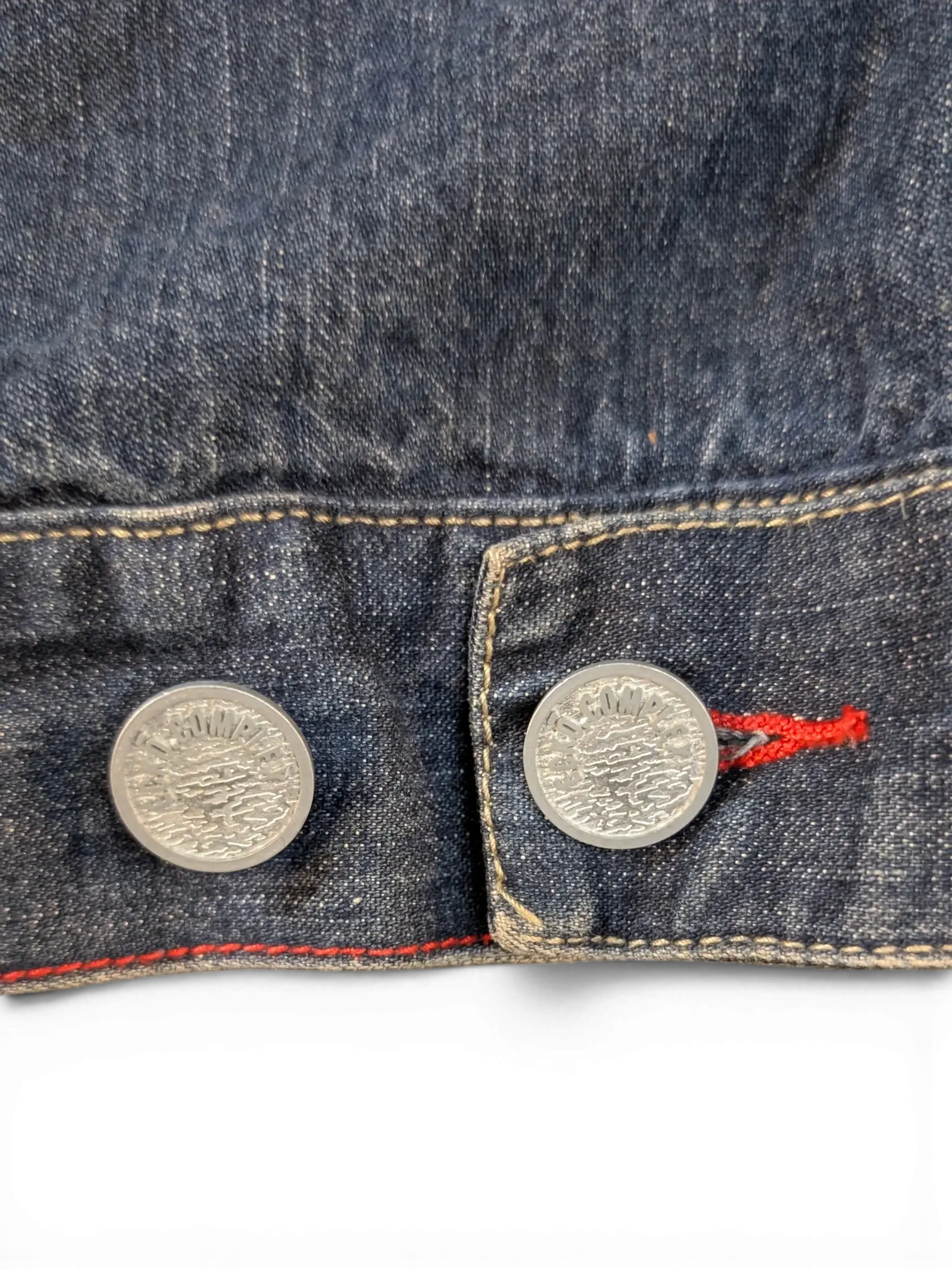 JAKE & IPI Ecko denim jacket with silver buttons and red stitching detail.