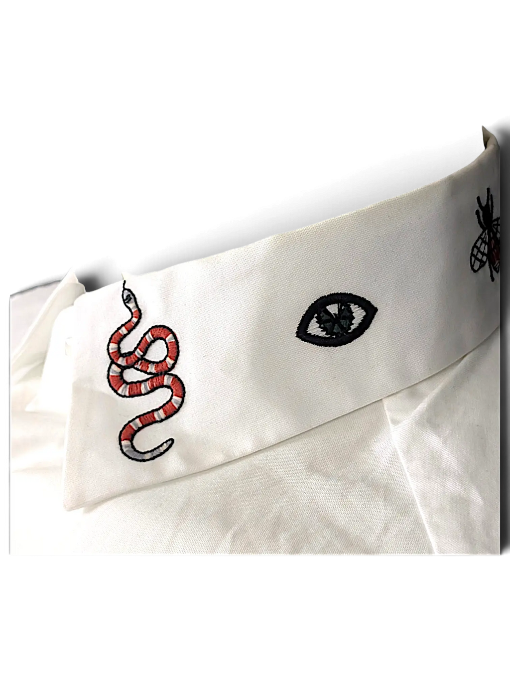 JAKE & IPI white cotton shirt collar featuring detailed embroidered snake, eye, and bee motifs