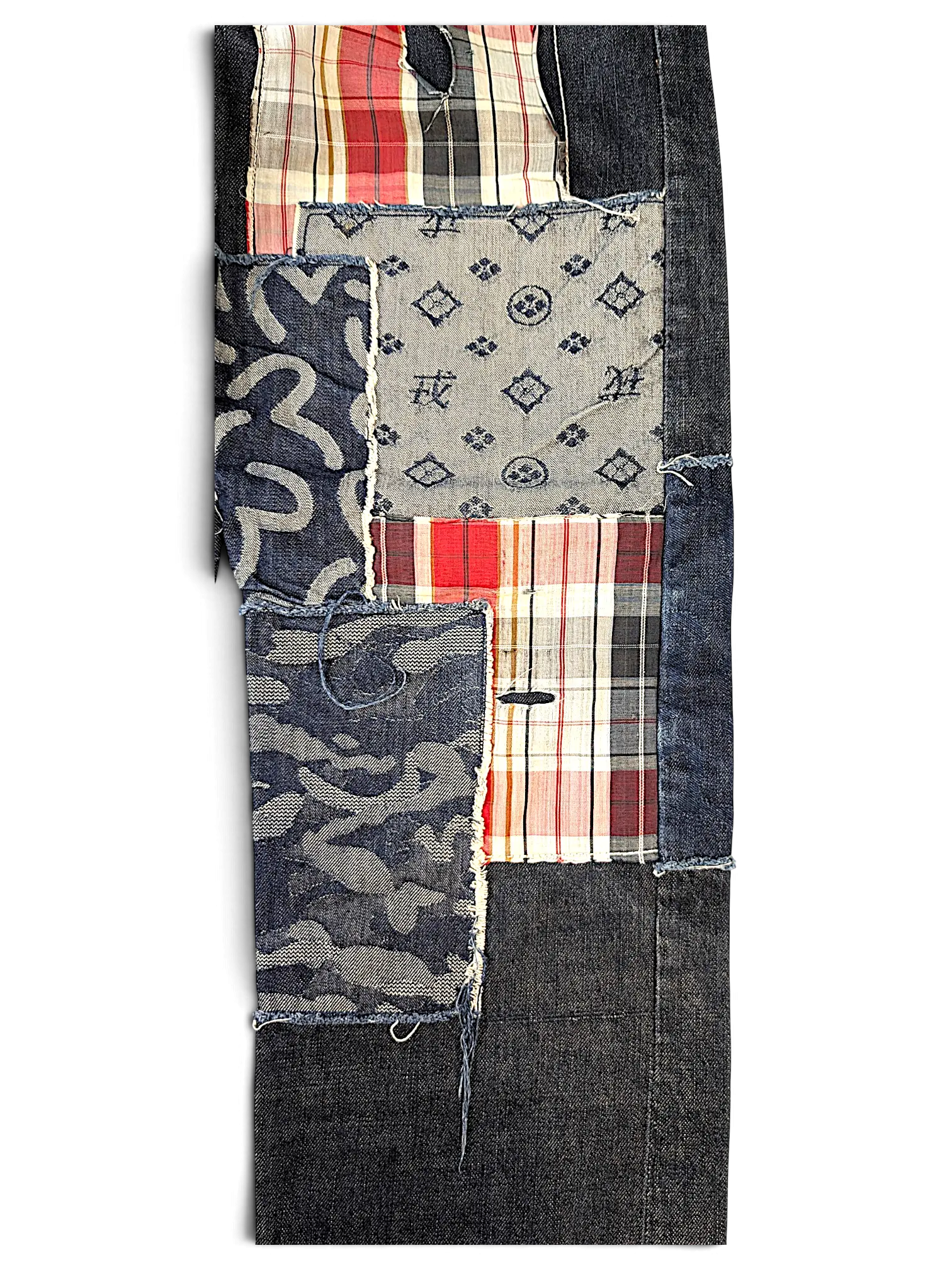 JAKE & IPI Evisu one of one jeans featuring a dark denim patchwork design with plaid and patterned fabric accents.