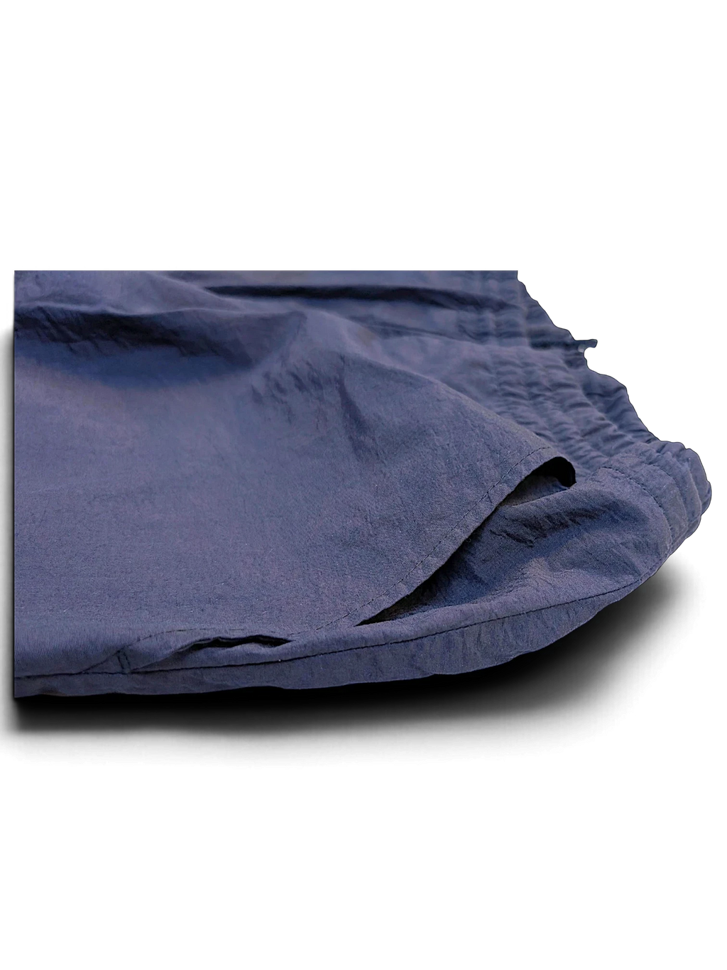 JAKE & IPI pre-owned Fila dark navy track pants with an elasticated waistband and side pocket detail.