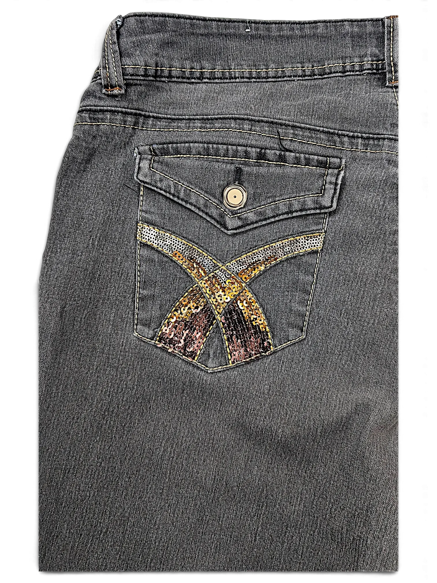 JAKE & IPI grey denim jeans featuring a back pocket with gold and bronze sequin cross detailing and a button flap.