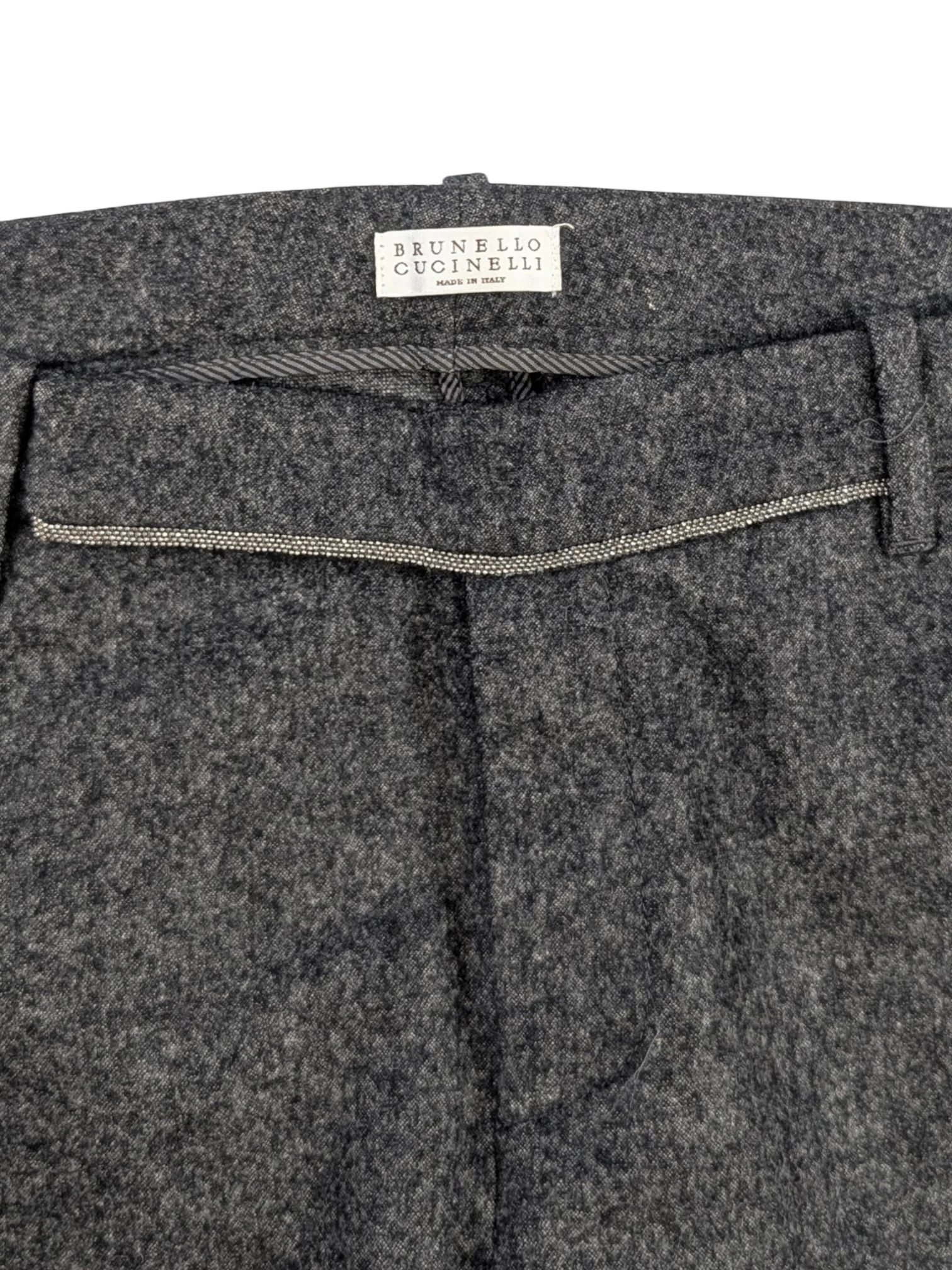 JAKE & IPI grey mélange wool blend flannel tailored trousers with subtle taper and horn-style buttons.