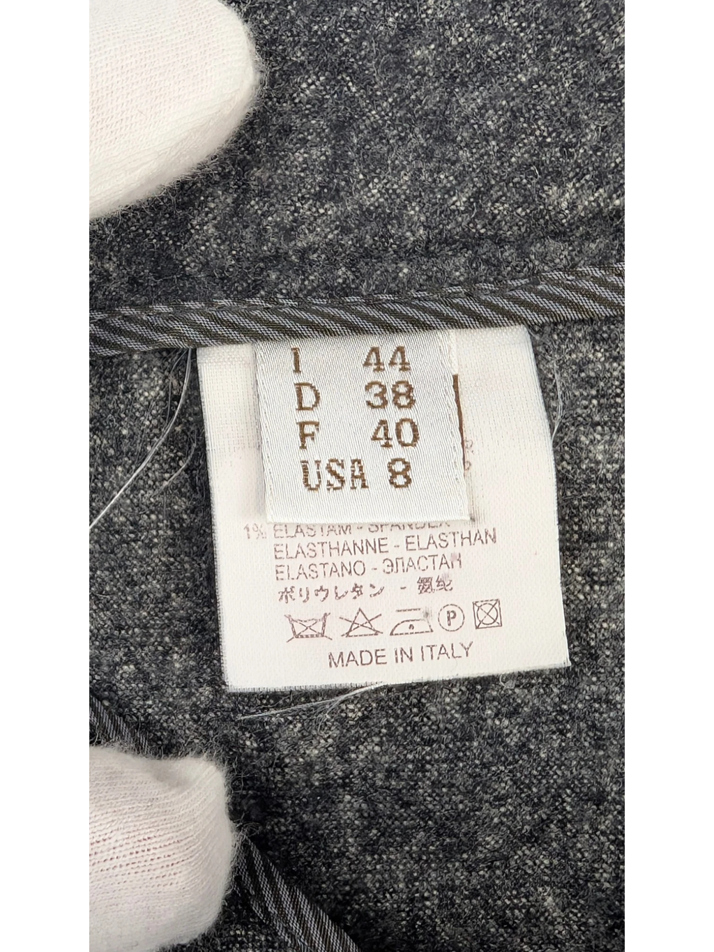 JAKE & IPI grey mélange wool blend tailored trousers with a subtle taper and rear welt pockets. Made in Italy.