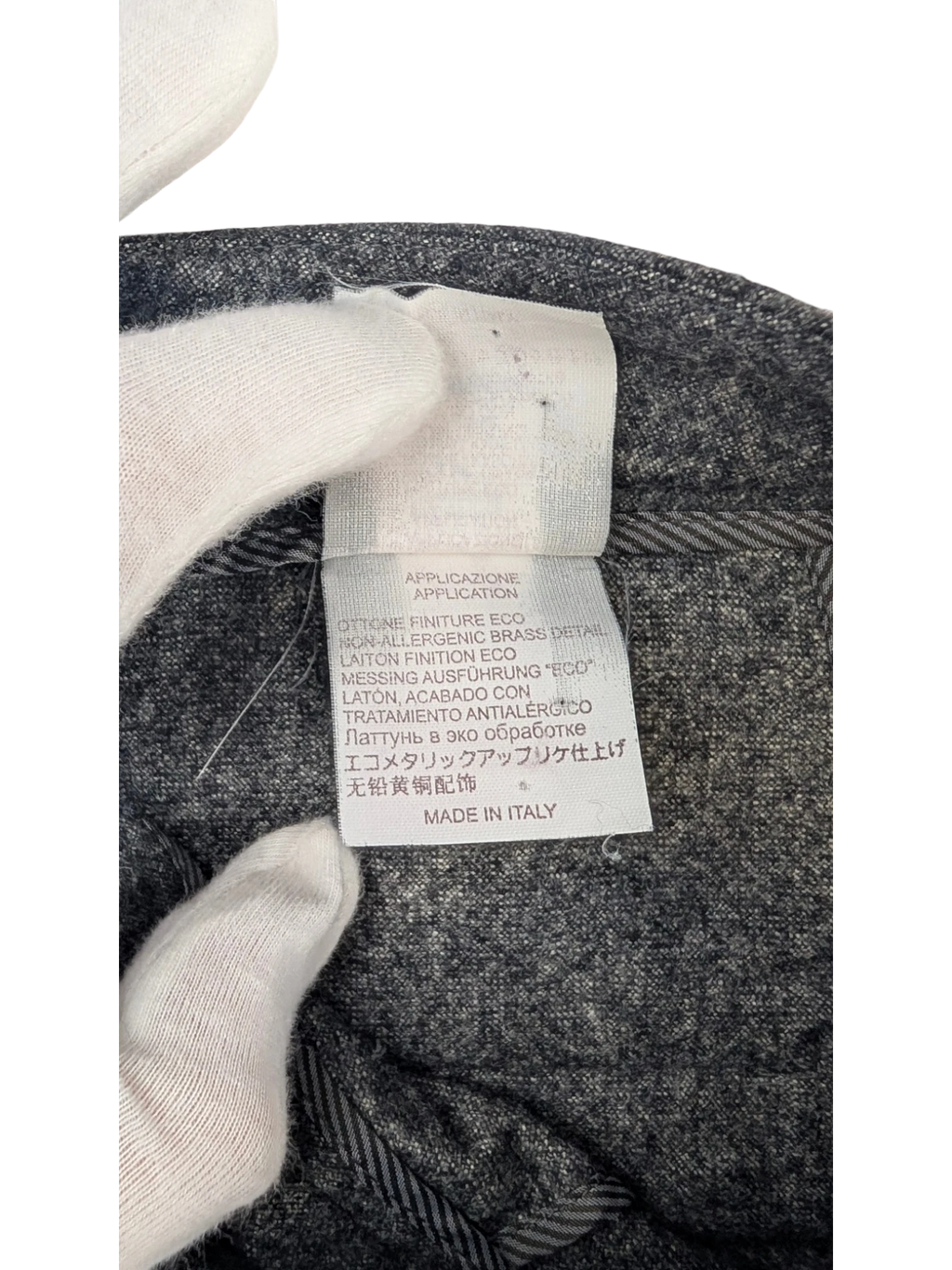 JAKE & IPI grey mélange wool blend flannel tailored trousers with belt loops and button closure. Made in Italy.