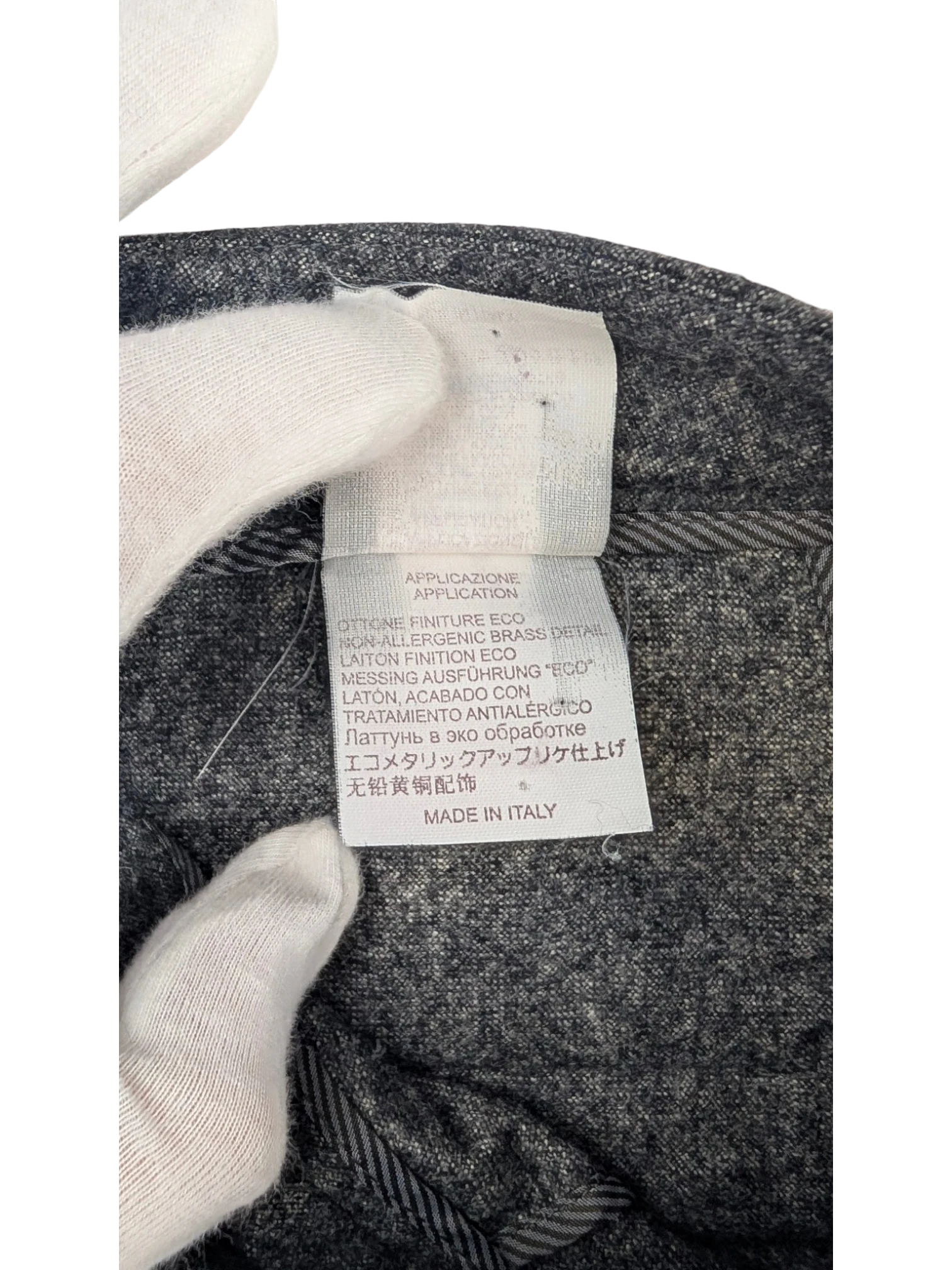 JAKE & IPI grey mélange wool blend flannel tailored trousers with belt loops and button closure. Made in Italy.