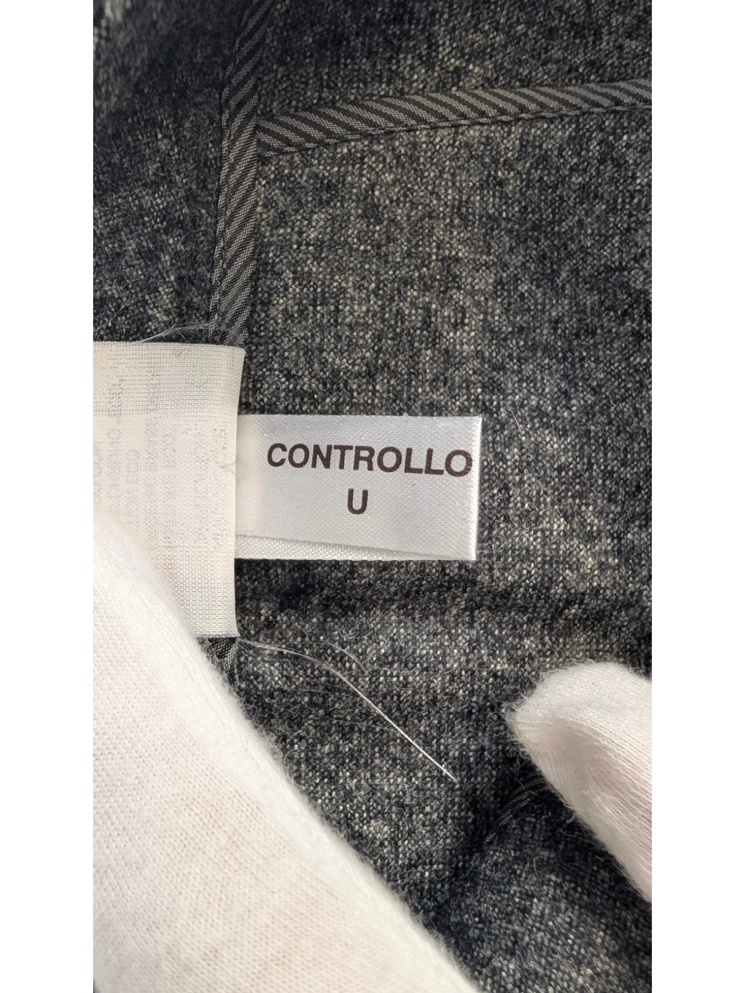 JAKE & IPI grey mélange wool blend tailored trousers with subtle taper and flannel finish.