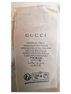 JAKE & IPI Gucci blue cap interior fabric care label with Made in Italy text and recycling symbols