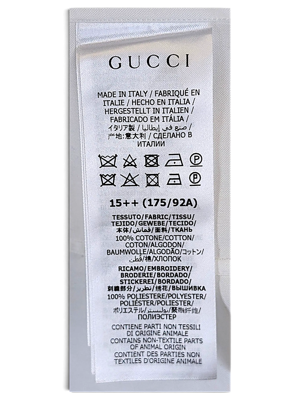 JAKE & IPI Gucci shirt white fabric care label with multilingual text and washing instructions