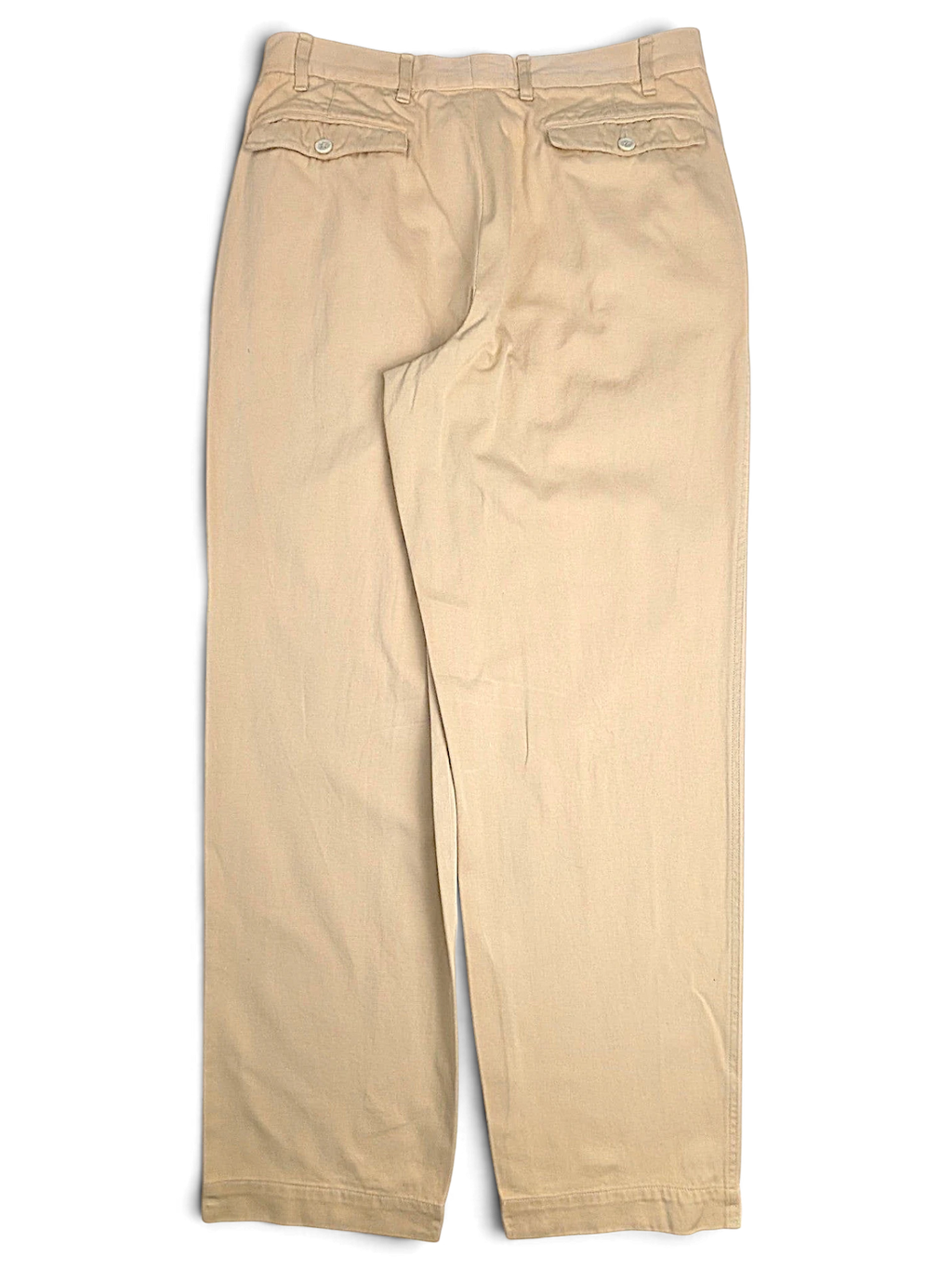 JAKE & IPI pre-owned Hilton Boutique beige pleated trousers with a tailored waistband and buttoned back pockets