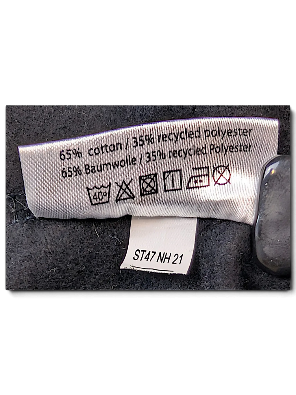 JAKE & IPI IBE Hypend crewneck sweatshirt care label showing 65% cotton and 35% recycled polyester fabric composition