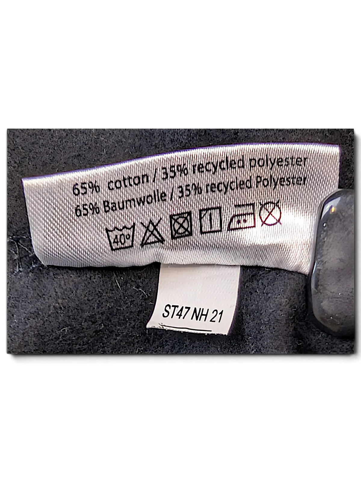JAKE & IPI IBE Hypend crewneck sweatshirt care label showing 65% cotton and 35% recycled polyester fabric composition