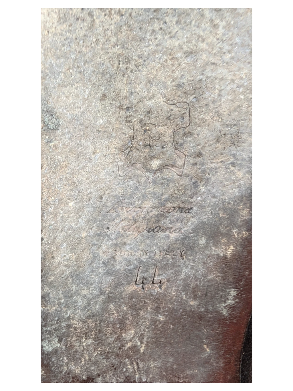 JAKE & IPI grey Italian leather texture detail with embossed Lavorazione Artigiana stamp and Made in Italy text