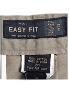 JAKE & IPI Jeanswest Easy Fit trousers label showing 100% cotton composition and size 31 on light grey taupe fabric