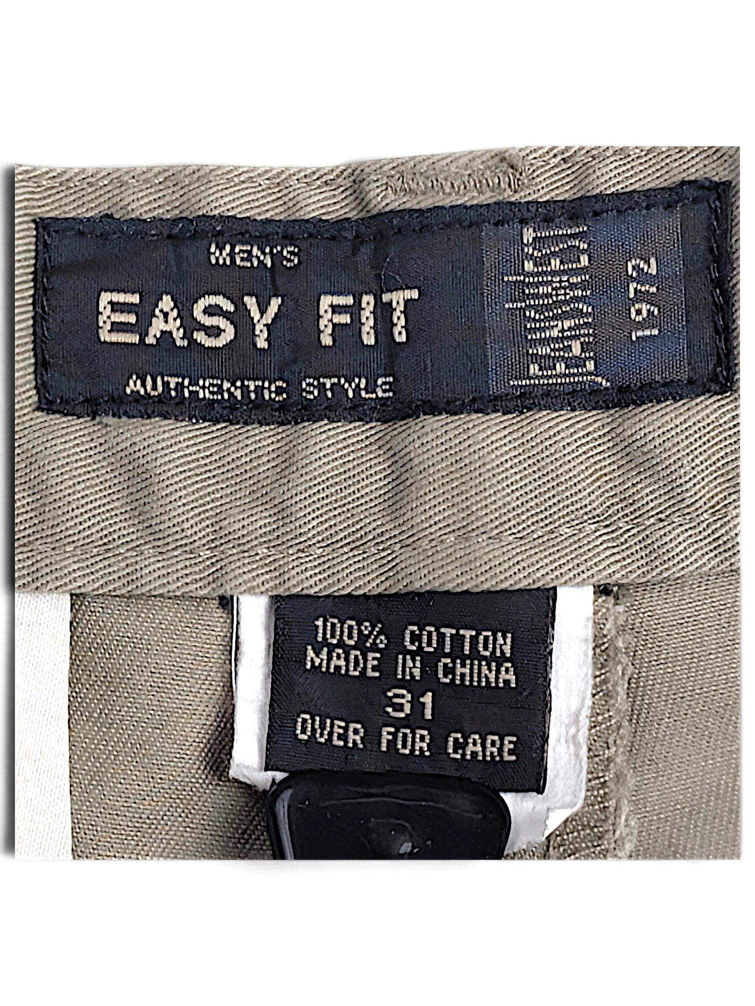 JAKE & IPI Jeanswest Easy Fit trousers label showing 100% cotton composition and size 31 on light grey taupe fabric
