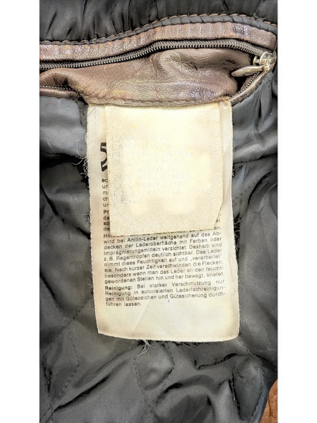 JAKE & IPI Josef Wormland brown leather jacket with quilted lining and care tag.