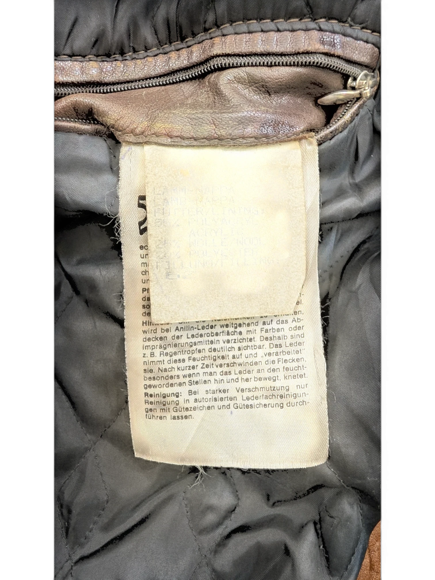 JAKE & IPI Josef Wormland brown leather jacket with quilted lining and care tag.