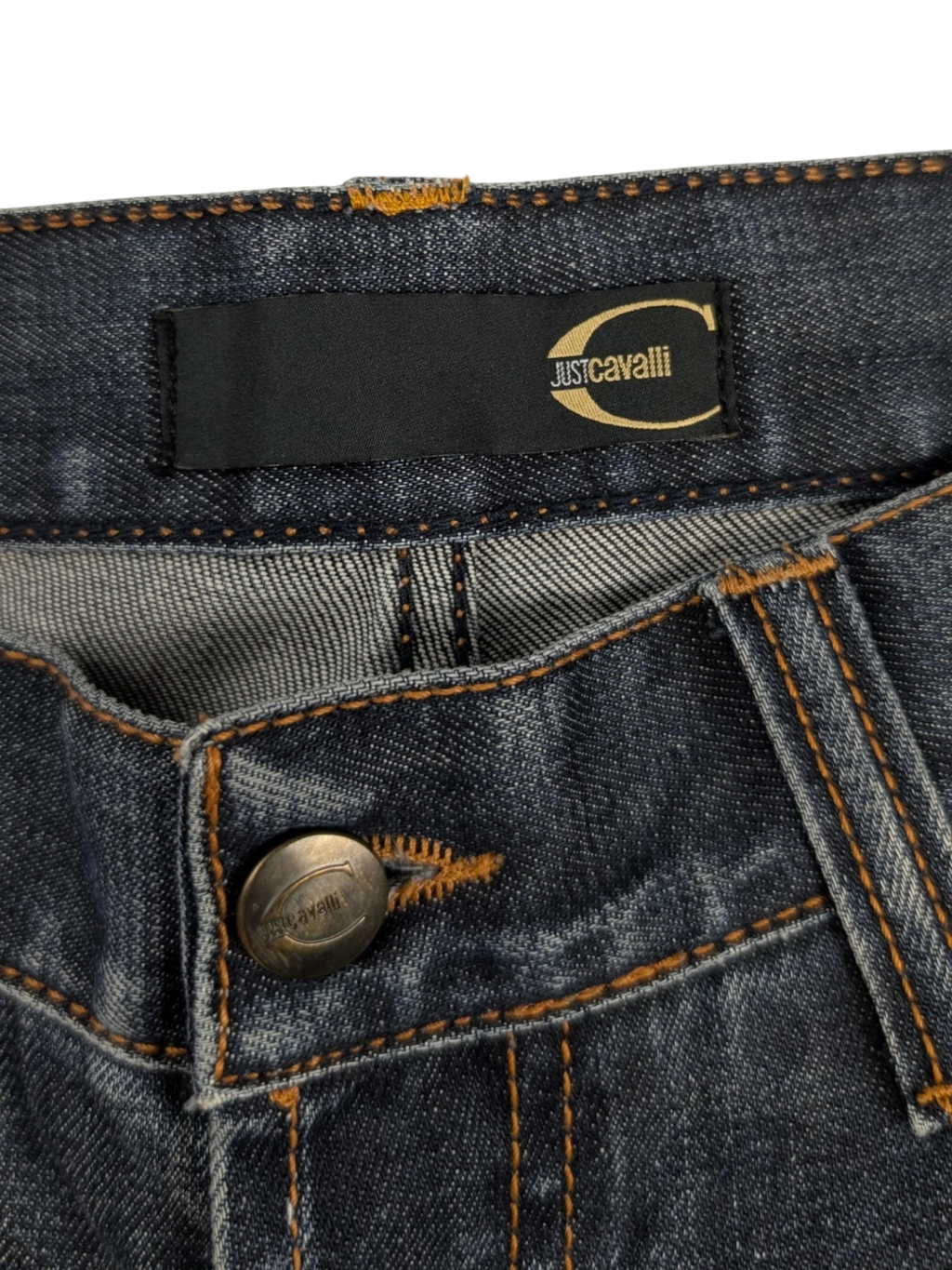 JAKE & IPI Just Cavalli distressed medium-wash blue denim straight-leg jeans with tobacco stitching and leather logo patch.