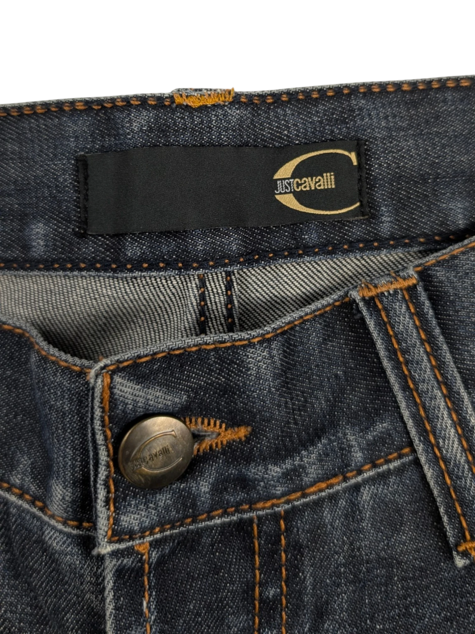 JAKE & IPI Just Cavalli distressed medium-wash blue denim straight-leg jeans with tobacco stitching and leather logo patch.