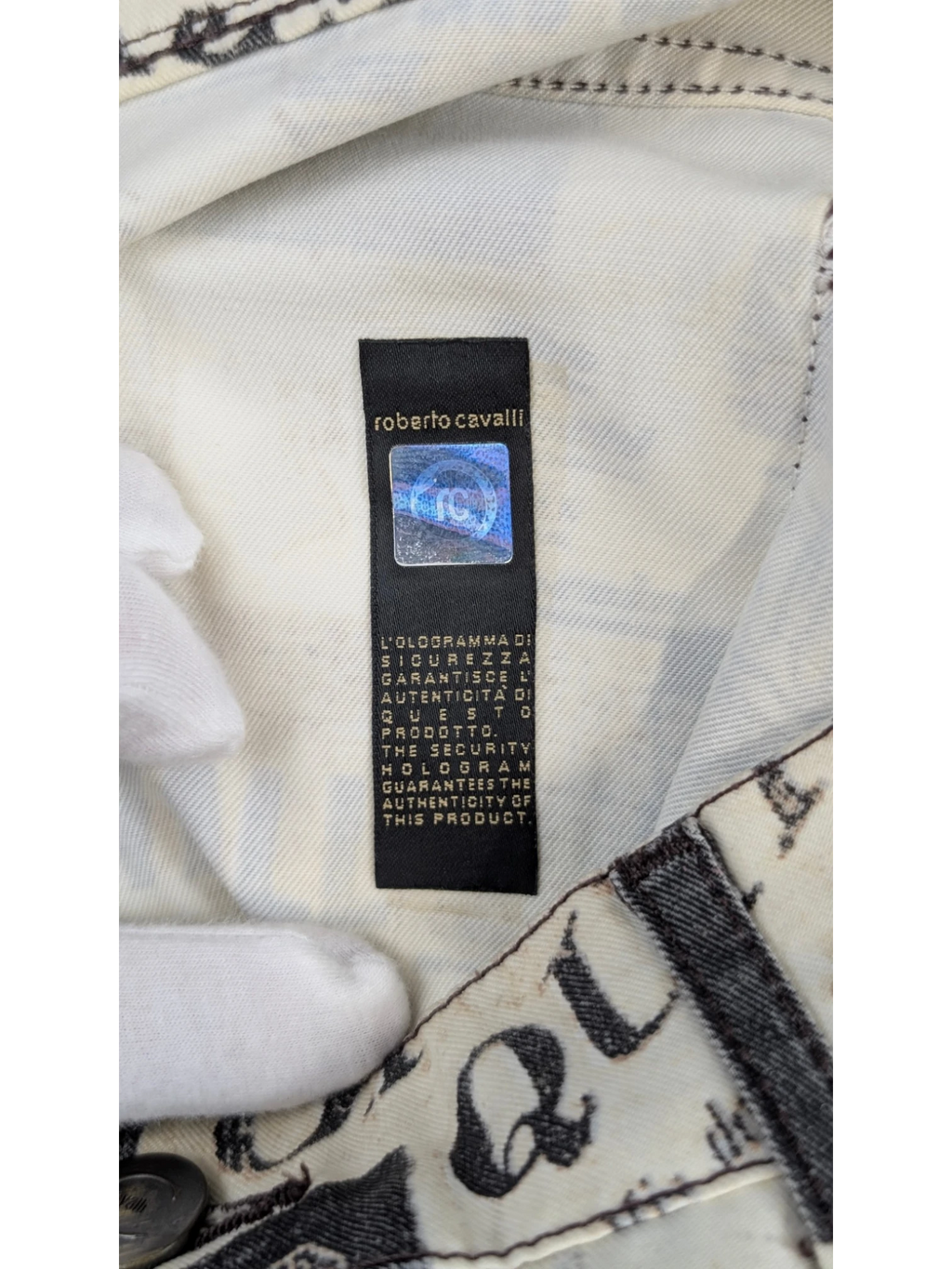 JAKE & IPI Just Cavalli newspaper print jeans in sepia, cream, and black. Slim fit, mid-rise, 5-pocket design. Y2K era.