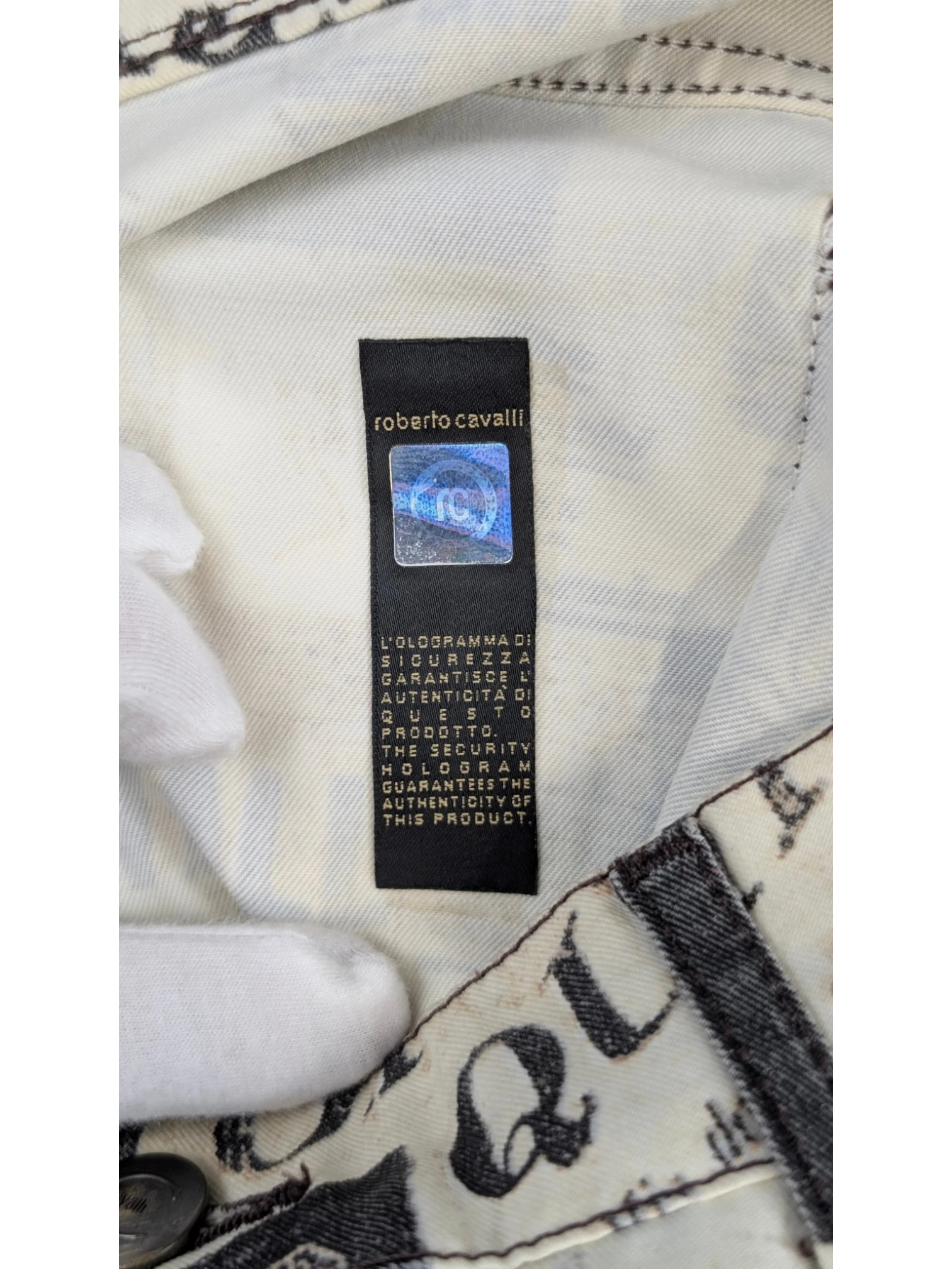 JAKE & IPI Just Cavalli newspaper print jeans in sepia, cream, and black. Slim fit, mid-rise, 5-pocket design. Y2K era.