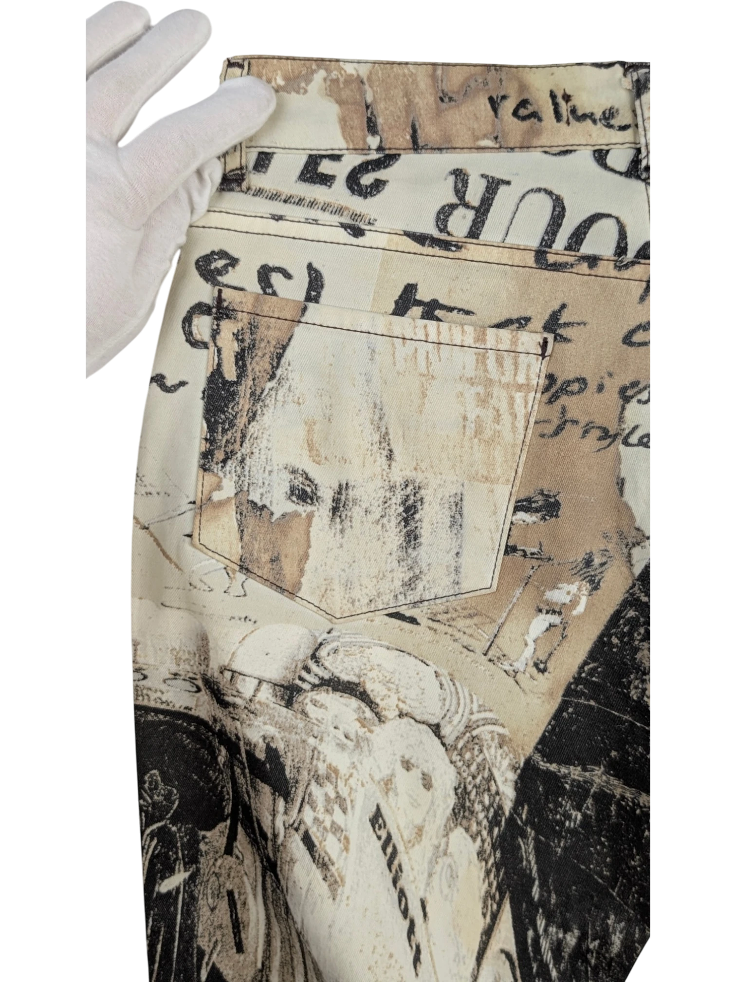 JAKE & IPI Just Cavalli newspaper print slim-fit jeans in sepia, cream, and black. Features mid-rise waist and 5-pocket design.