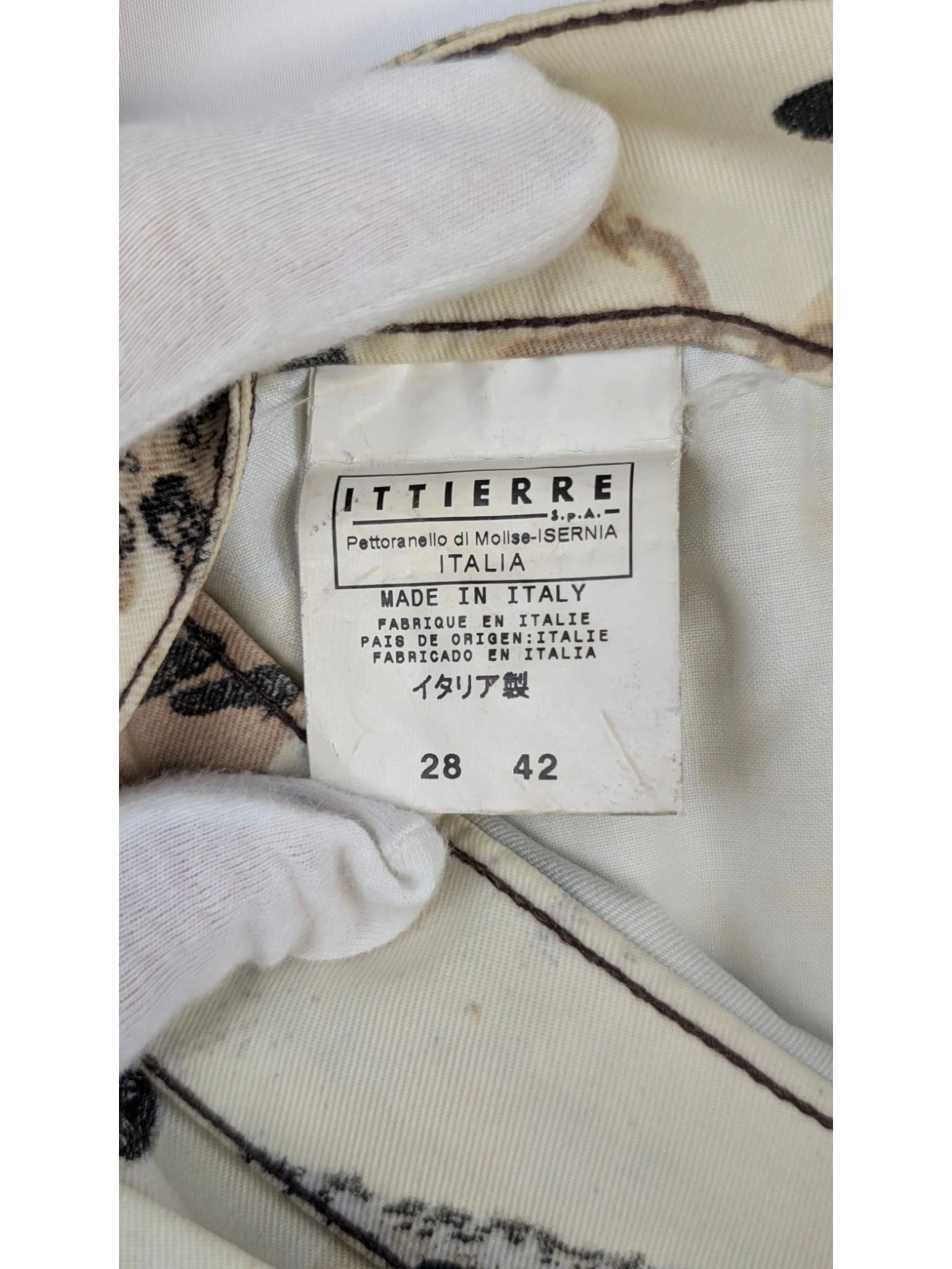JAKE & IPI Just Cavalli newspaper print jeans, sepia, cream, and black tones. Slim straight cut, mid-rise waist, 5-pocket design. Y2K era.