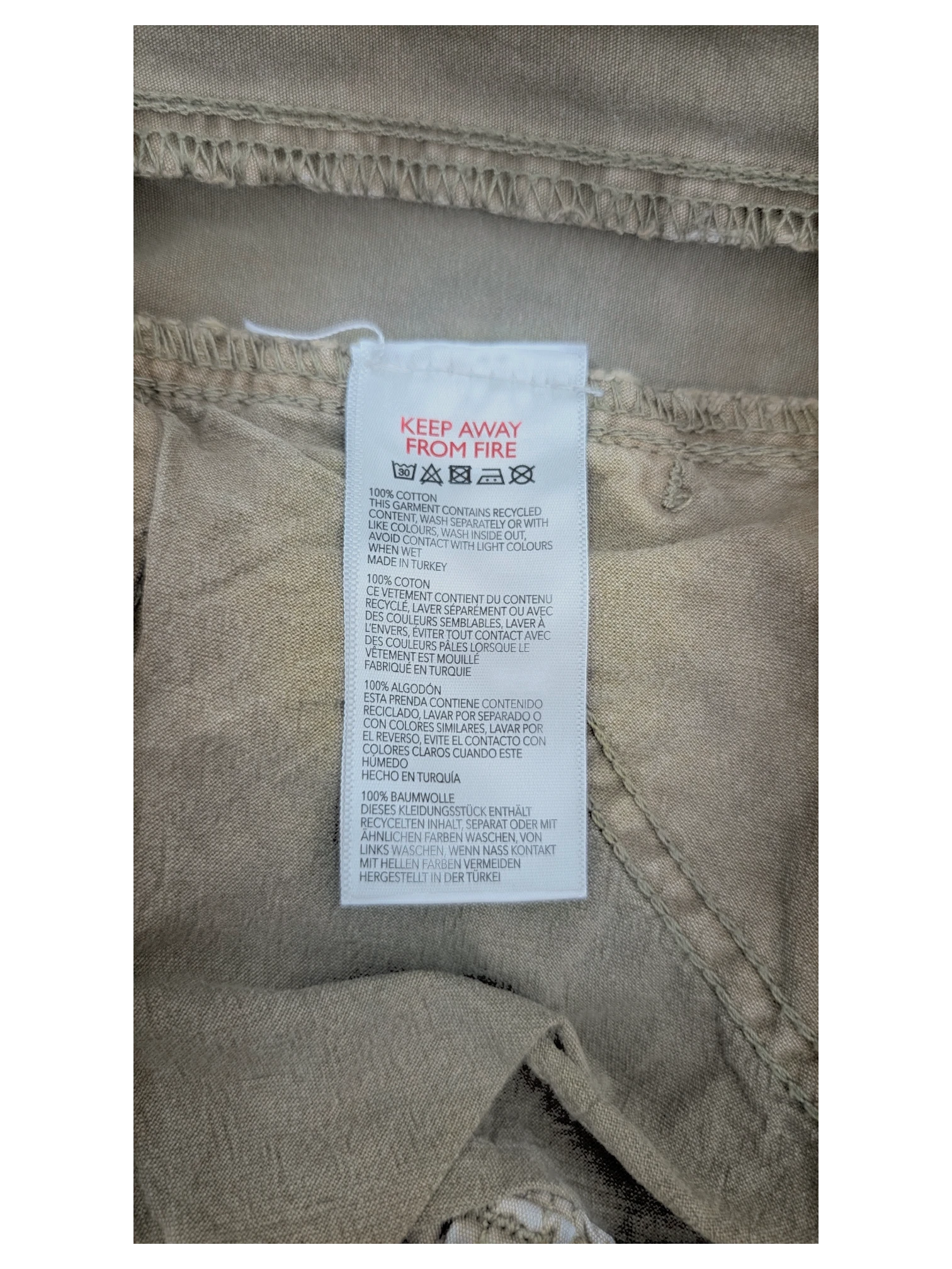 JAKE & IPI khaki cotton Y2K cargo pants with multiple pockets and a relaxed fit.