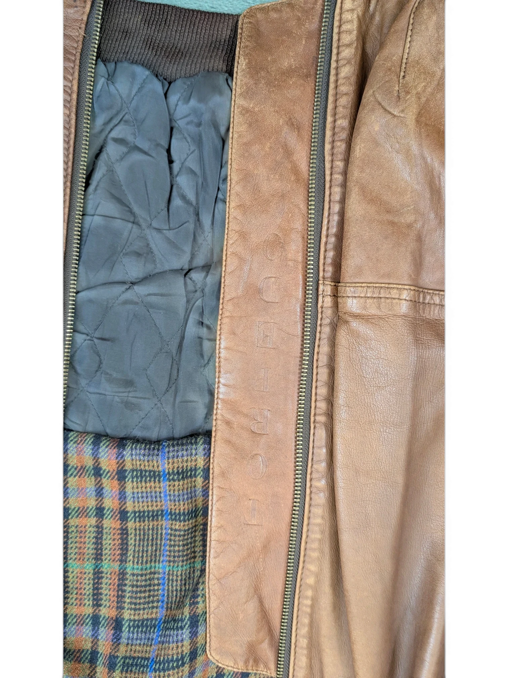 JAKE & IPI Josef Wormland brown leather jacket with quilted lining and plaid interior.
