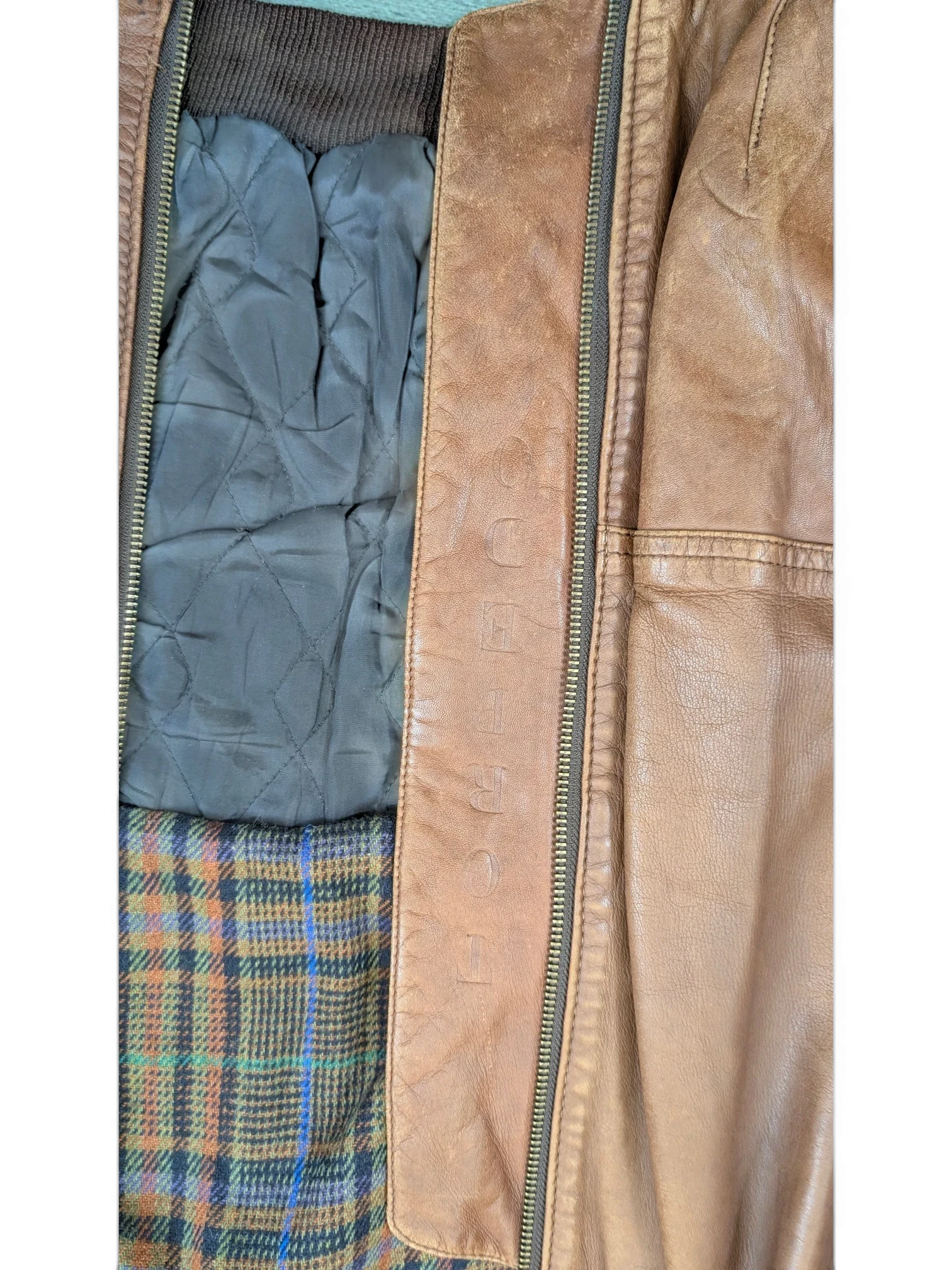 JAKE & IPI Josef Wormland brown leather jacket with quilted lining and plaid interior.