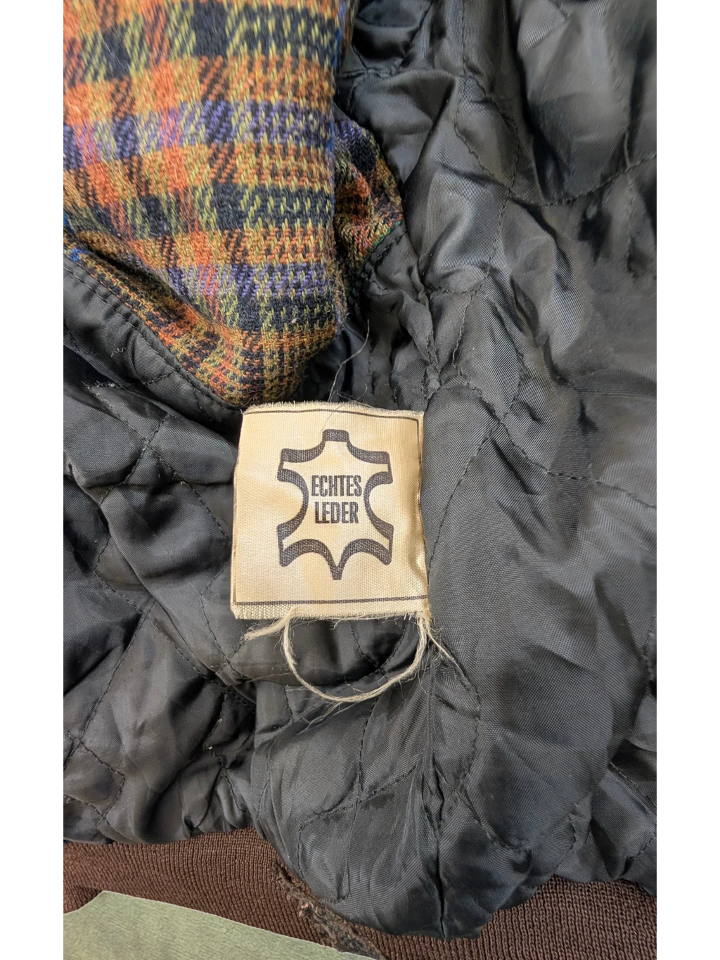 JAKE & IPI Josef Wormland leather jacket lining with plaid fabric detail and "Echtes Leder" tag.