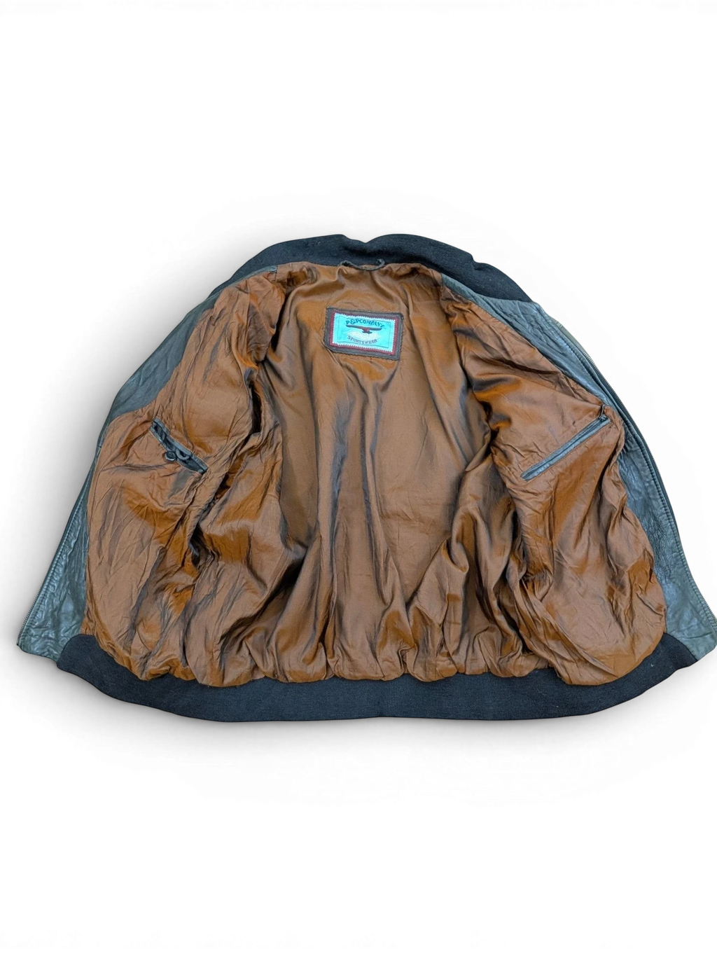 JAKE & IPI black leather sportswear jacket with brown satin lining and ribbed cuffs.