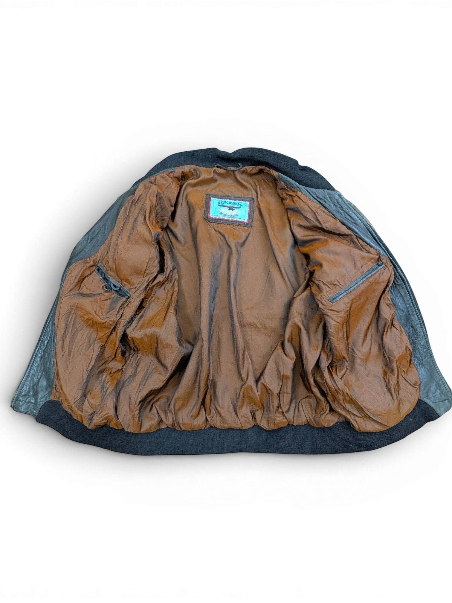 JAKE & IPI black leather sportswear jacket with brown satin lining and ribbed cuffs.