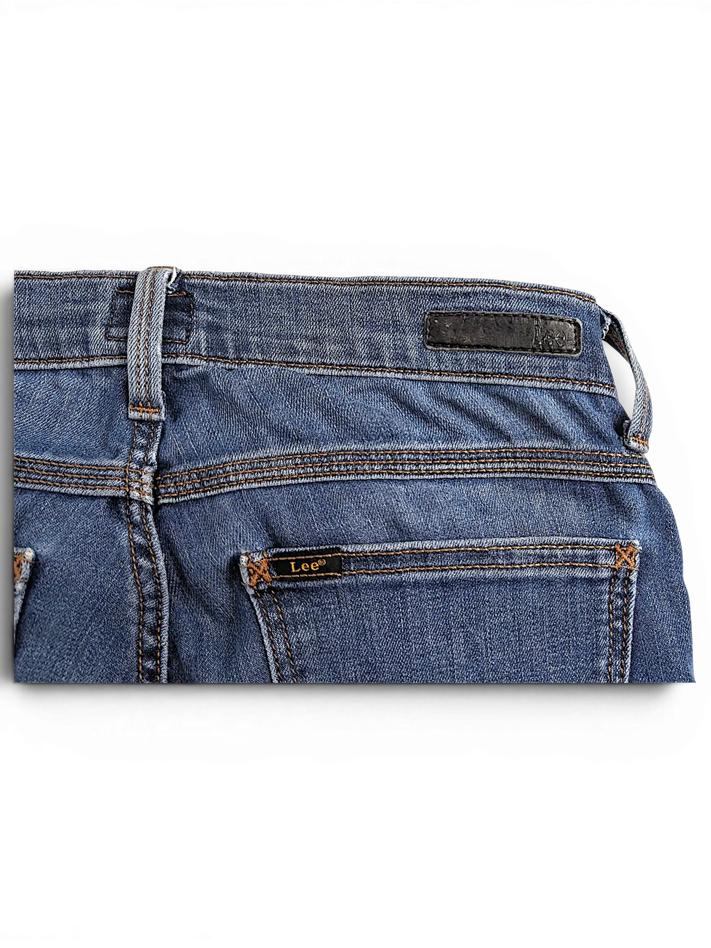 JAKE & IPI Lee Jade blue denim jeans featuring a leather brand patch and back pocket stitching detail
