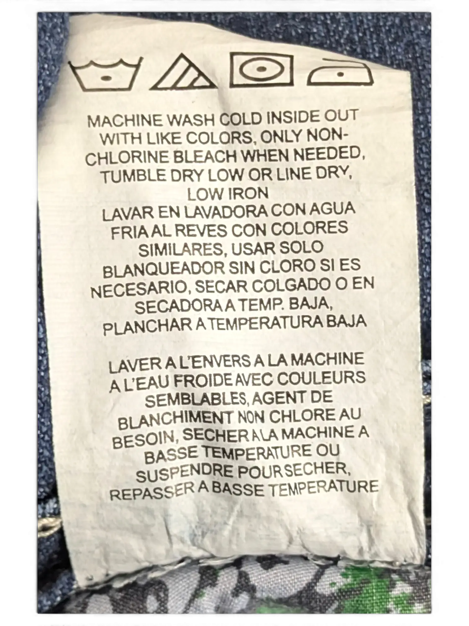 JAKE & IPI Lee Slender Secret 14 M jeans care label with washing instructions in English, Spanish, and French.