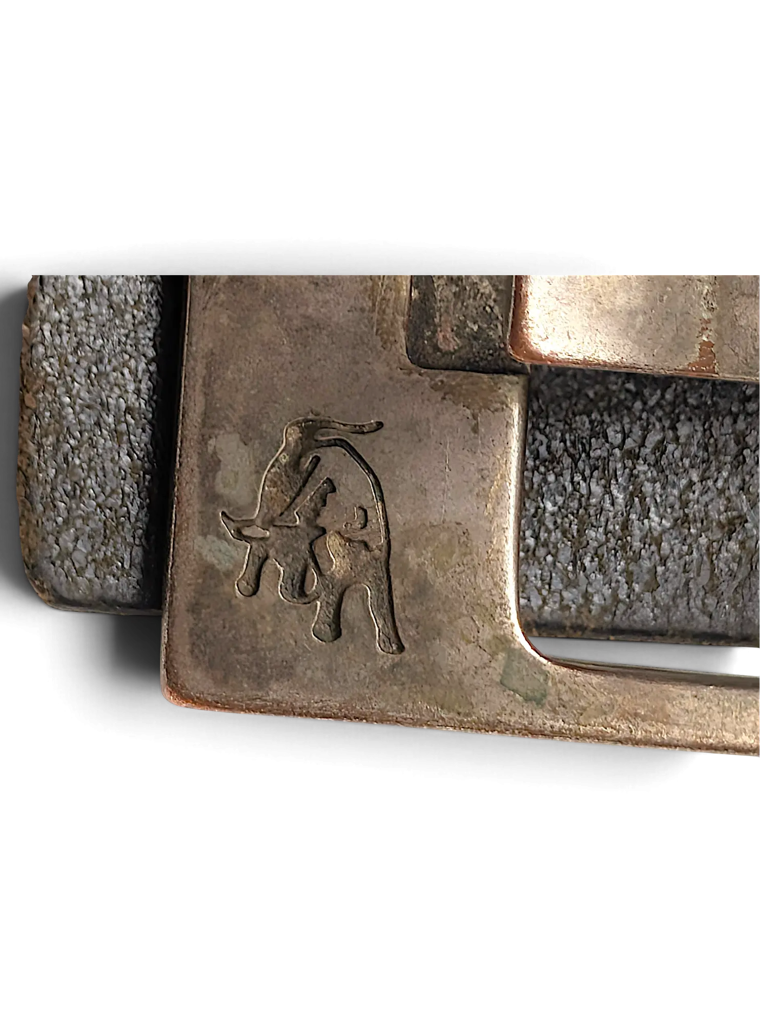 JAKE & IPI Legend black belt featuring a metallic buckle with a detailed bull logo engraving