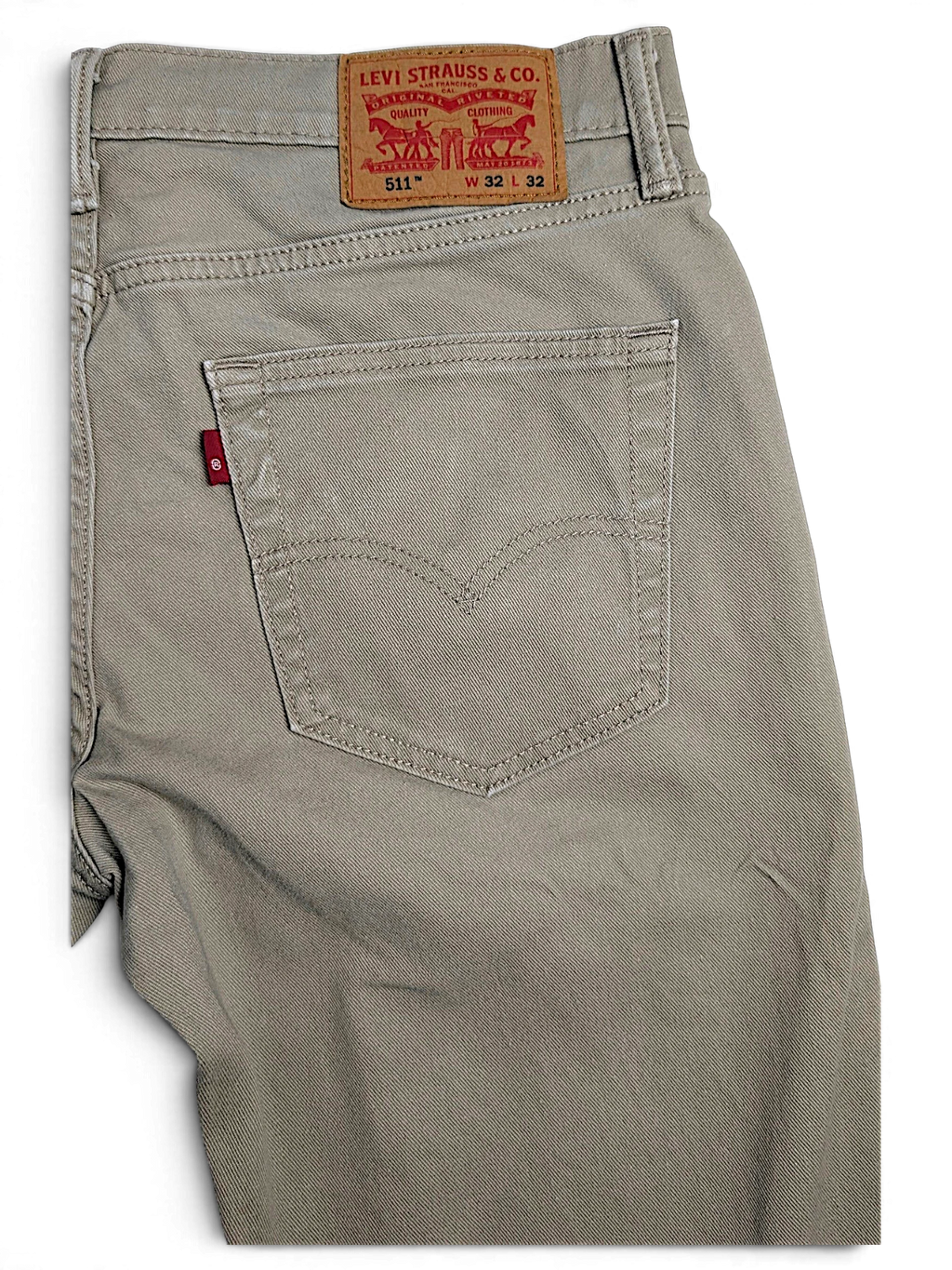 JAKE & IPI pre-owned Levi’s 511 slim fit beige stretch denim jeans with classic back pocket and leather patch
