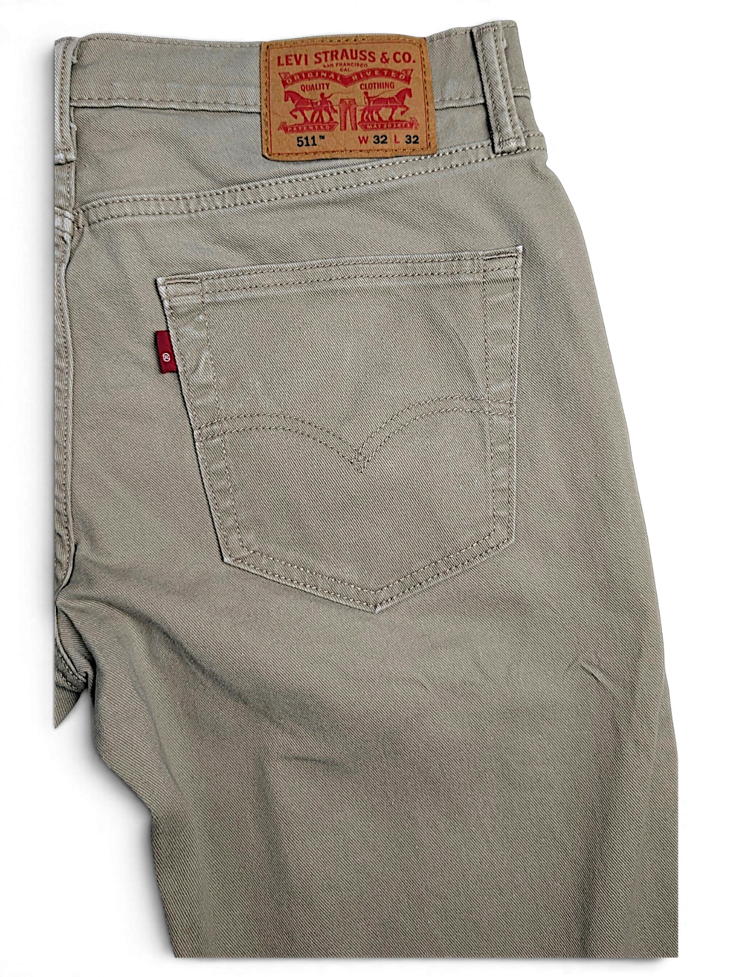 JAKE & IPI pre-owned Levi’s 511 slim fit beige stretch denim jeans with classic back pocket and leather patch