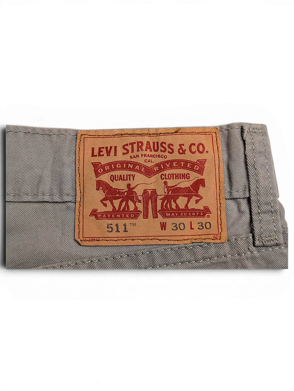 JAKE & IPI Levi's 511 chino pants featuring the iconic tan leather brand patch on grey cotton fabric