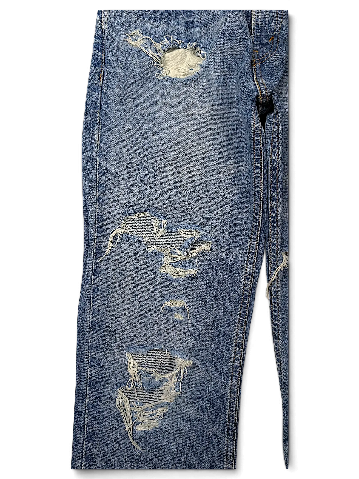 JAKE & IPI Levi's 511 slim fit blue denim jeans featuring distressed ripped details and frayed knee holes.