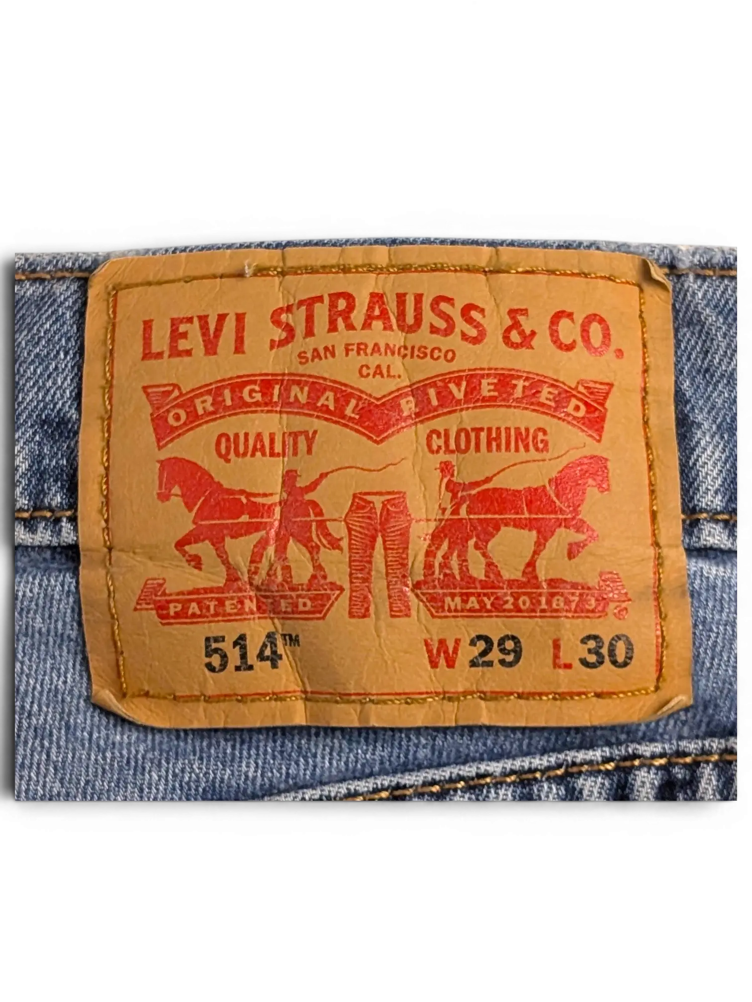 JAKE & IPI Levi's 514 blue denim jeans with leather back waist patch showing size W29 L30