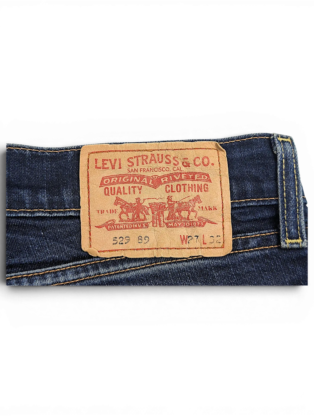 JAKE & IPI Levi's 529 89 bootcut jeans featuring a classic tan leather brand patch on dark blue denim fabric